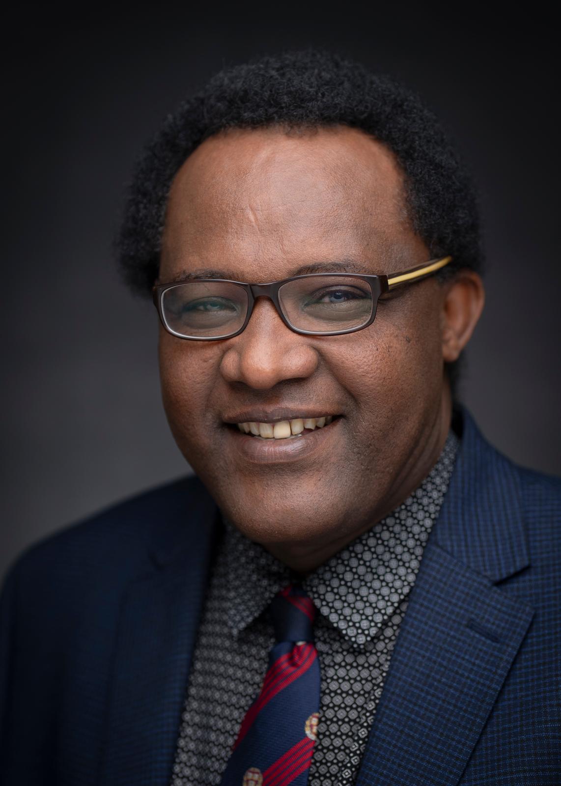 Portrait of Abate L. Kenna, PhD, founder and owner of Research & Evaluation Resonance
